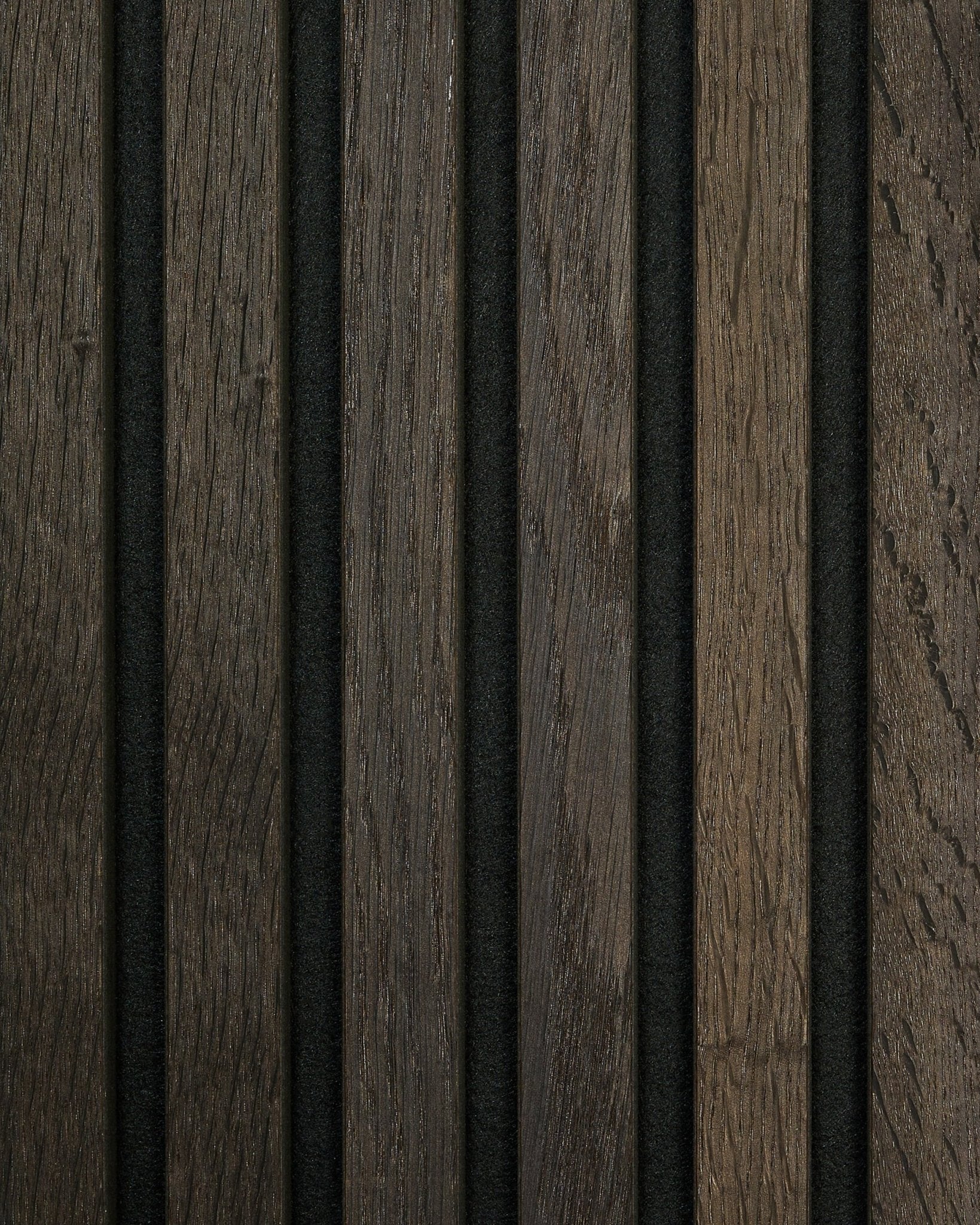 Close-up of WoodUpp Akupanel Rustic Sample in Smoked Oak featuring vertical acoustic slats in light and dark brown tones with slim black gaps.